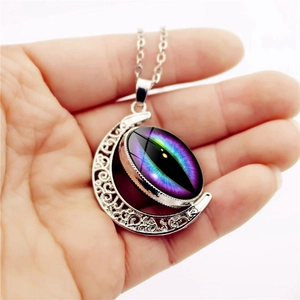 Vintage fantasy dragon eye moon pendant necklace with detailed silver hollow carvings