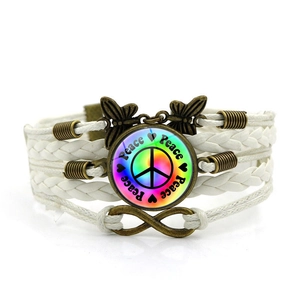 White braided multilayer bracelet with peace sign, butterfly and infinity charms