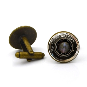 Detailed macro view showing the vintage camera lens dial design on bronze alloy cufflinks