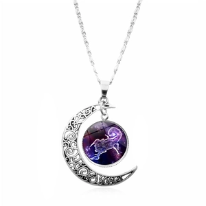 Detail view of Scorpio zodiac glass gem inside silver hollow moon pendant necklace