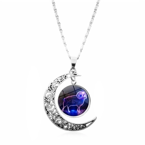 Macro detail of Aries zodiac moon pendant with purple glowing galaxy glass stone