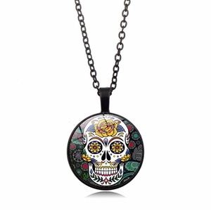 Detailed macro view of the Mexico Sugar Skull pendant with vibrant floral patterns