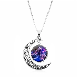Detailed close-up of a silver moon pendant necklace with purple celestial art