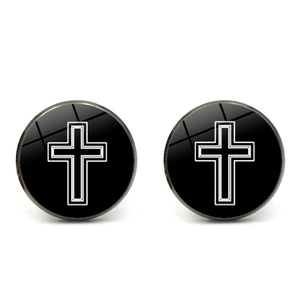 Macro shot of circular cross pattern cufflinks featuring a polished glass dome surface