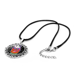 Vintage Russian Matryoshka doll necklace with silver filigree pendant on black cord