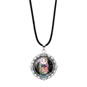 Detail of Matryoshka doll glass pendant necklace with antique silver hollow frame