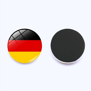 Macro shot of 25mm round German flag glass fridge magnet showing front and back