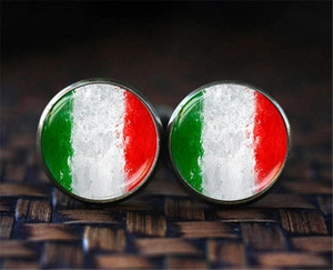 Macro detail of round business cufflinks featuring a vintage Italian flag marble pattern