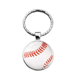 Detailed view of metal baseball keychain with realistic red stitching and silver ring
