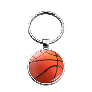 Detailed close-up of a silver keychain with a high-gloss 3D basketball motif