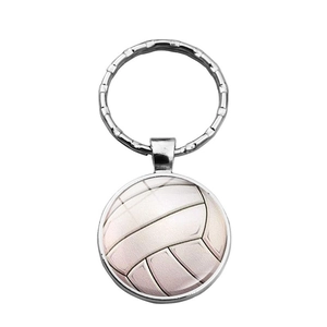 Close-up of a volleyball keychain pendant featuring a realistic textured ball design