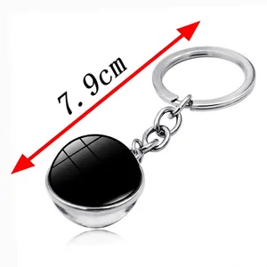 Porte-clés en métal argenté de 7,9 cm de long avec un pendentif boule en verre noir poli