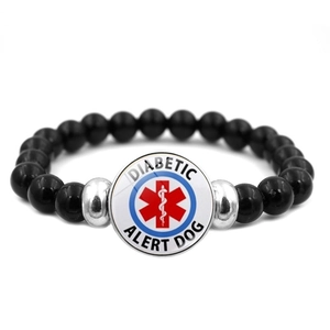 Detail of medical alert bracelet with black beads and Diabetic Alert Dog logo disk