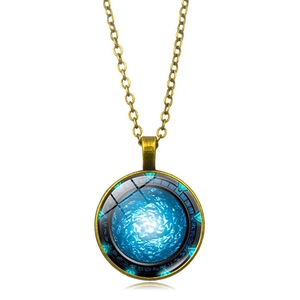 Macro shot of Stargate Atlantis glass pendant with blue nebula pattern and bronze chain