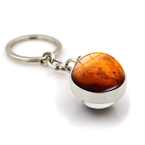 Creative galaxy keychain with silver metal ring and glass dome showing Mars planet patterns