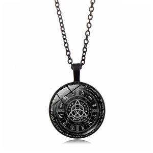 Detail view of gothic astrology pendant with Triquetra and zodiac symbols on black chain