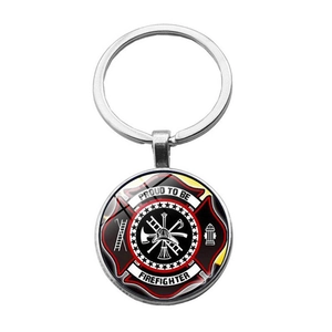 Detail of firefighter keychain with Maltese cross and proud to be firefighter text