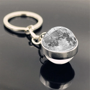 Detailed view of the realistic Moon surface texture within the glass moon keychain