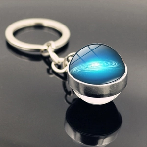 Detailed view of the Milky Way glass sphere keychain with polished silver metal base