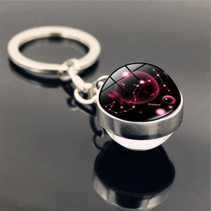 Scorpio zodiac double-sided glass ball keychain with celestial constellation design