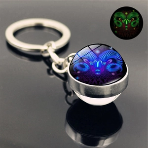 Luminous Aries zodiac keychain with glowing glass ball and silver metal ring detail