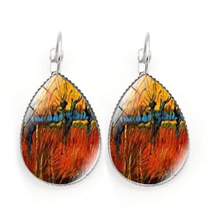 Detail view of silver lever-back drop earrings with Van Gogh style sunset oil painting art