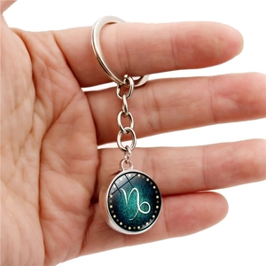 Luminous Capricorn constellation glass ball keychain with blue starry sky and silver metal ring