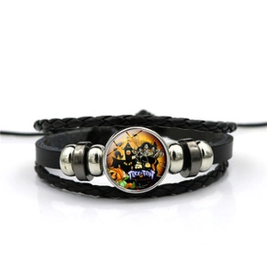 Detail of hand-woven leather bracelet featuring Route 66 glass gem and metal beads