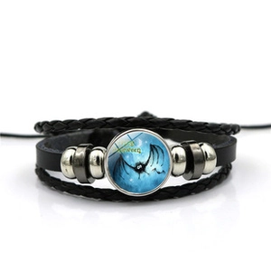 Detail of multi-layer leather bracelet with Halloween bat pattern and Happy Halloween text