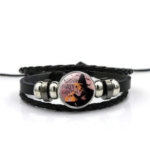 Detailed macro view of multi-layer leather bracelet with Halloween witch theme glass gem