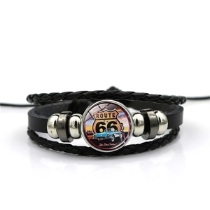 Detail view of American Route 66 multilayer leather bracelet with retro car glass dome