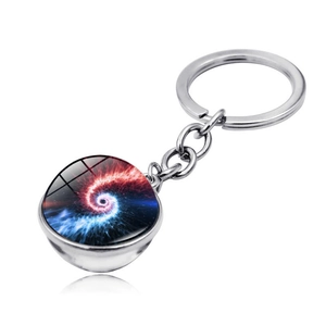 Macro shot of 3D cosmic galaxy nebula pendant with red and blue spiral glass sphere