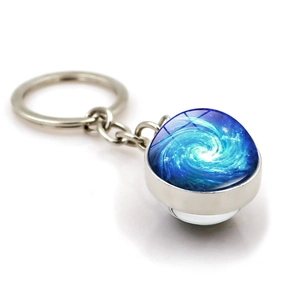 Cosmic space swirl glass ball keychain with silver metal ring and galaxy pattern