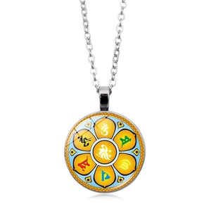 Macro detail of silver alloy Buddhist pendant with colorful lotus and Six Syllable Mantra