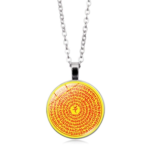 Macro detail of Buddhist Shurangama Mantra pendant with Sanskrit scripture on silver chain