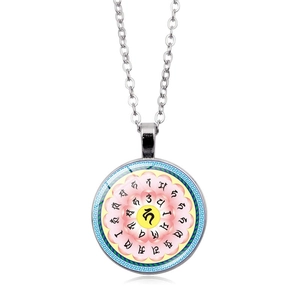 Close-up of circular gemstone necklace with colorful Sanskrit lotus pattern on silver chain