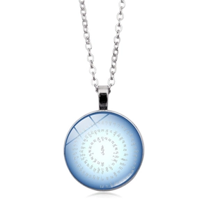 Macro detail of a round gemstone pendant necklace with blue spiral mantra and silver chain