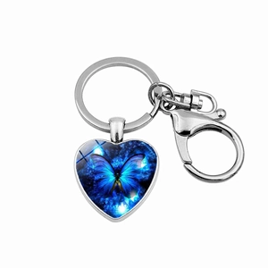 Blue butterfly heart-shaped keychain with silver metal lobster clasp and star background
