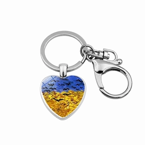 Detail of heart-shaped keychain featuring Van Gogh's Wheatfield with Crows artwork