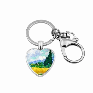 Macro detail of heart-shaped keychain featuring Van Gogh's Wheat Field with Cypresses art