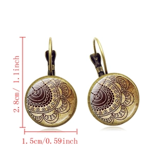 Detailed view of bohemian mandala earrings in bronze alloy with glass size parameters