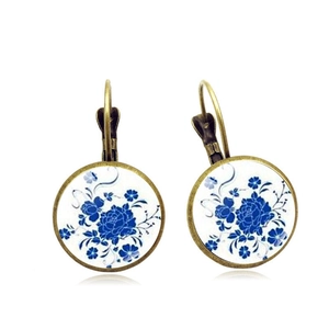 Detailed view of vintage bohemian round earrings with blue peony porcelain pattern