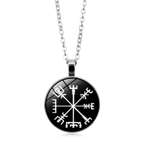 Detail of Viking Vegvisir compass pendant with polished glass dome on silver chain