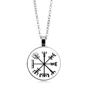 Macro detail of silver Viking Vegvisir compass pendant necklace with glass dome inlay