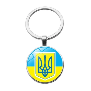 Detailed view of Ukraine flag keychain with blue and yellow national emblem pendant