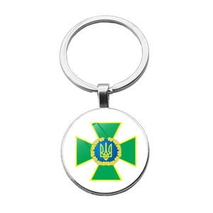 Detailed view of the SBU emblem keychain with silver polished metal finish and split ring