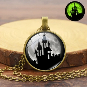Luminous Halloween necklace with vintage bronze pendant featuring castle and full moon