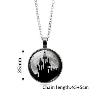 Macro view of 25mm round glass pendant necklace with spooky castle silhouette