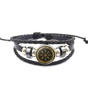 Handmade multilayer leather bracelet featuring a golden Viking compass Vegvisir symbol