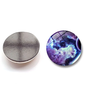 Close-up of circular galaxy fridge magnets with glass dome and magnetic back